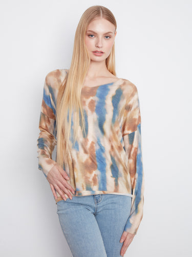 Knit top with a V-neckline, showcasing an abstract pattern in earthy and blue tones, perfect for casual wear by Charlie B.