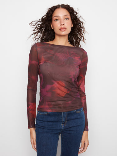 This top features a boat neckline, adding elegance to its floral pattern design. Perfect for any occasion. By Charlie B.