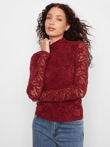 This elegant top features a mock neck design, adding a touch of sophistication to any outfit by Charlie B.