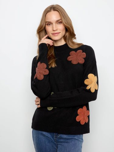 This sweater features a classic crew neckline, offering a timeless and versatile look for any wardrobe. By Charlie B.