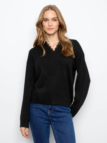 Black sweater with a stylish V-notch neckline featuring leopard print trim, ideal for a chic look by Charlie B.