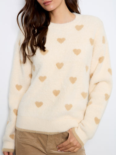 Soft sweater featuring jacquard heart embroidery, adding a whimsical flair to your wardrobe essentials. By Charlie B.