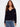 Navy sweater with drop shoulders and delicate white trim detail, creating a casual yet stylish look by Charlie B.