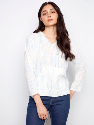 Casual pullover with a stylish hooded design, perfect for layering and adding a relaxed vibe to your outfit. Made by Charlie B.