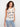 The top features a classic crew neckline, adding elegance to any outfit. Designed by Charlie B.