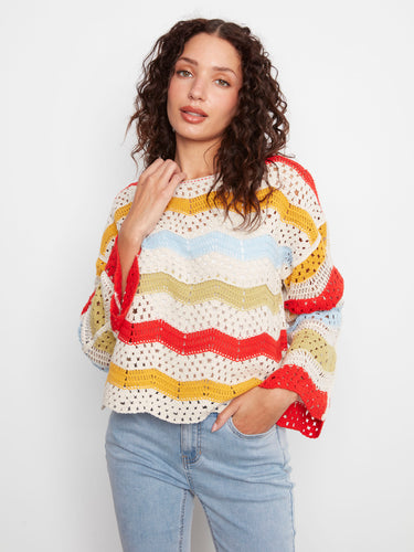 Colorful crochet top with drop shoulders and scalloped hem, adding a playful touch to your wardrobe by Charlie B.