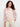 White crochet top with pink floral pattern and boat neckline by Charlie B.