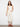 Natural cropped twill pants featuring five pockets and intricate hem embroidery for a stylish touch by Charlie B.