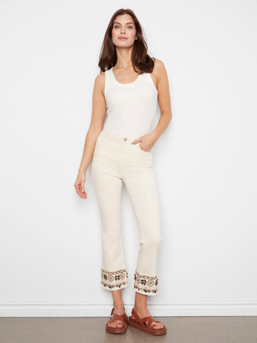 Natural cropped twill pants featuring five pockets and intricate hem embroidery for a stylish touch by Charlie B.