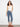 Medium blue jeans with a slim fit and flared leg, featuring floral embroidery at the hem and a classic design by Charlie B.