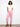 Pink cropped pants with a slim fit silhouette, featuring cuffed hems for added style. By Charlie B.