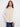 Greige vest featuring welt pockets and a soft faux fur texture, perfect for a cozy look by Charlie B.