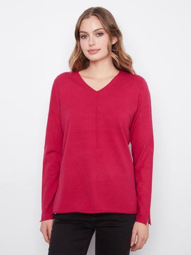 Soft knit top featuring a flattering V-neckline, perfect for casual outings. The rich color adds a touch of elegance. By Charlie B.