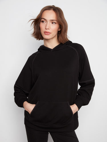 The hoodie features a relaxed fit, perfect for casual outings and lounging in comfort. By Charlie B.
