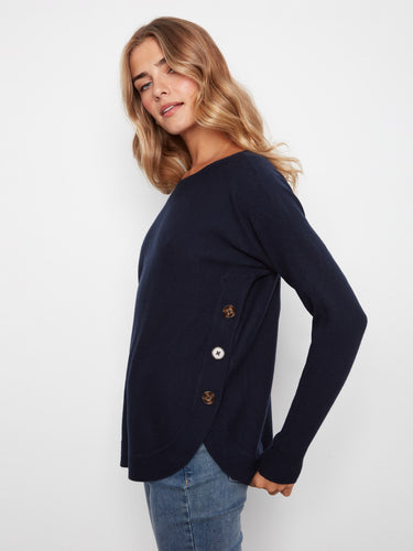 Navy sweater with a stylish boat neck and ribbed sleeves, perfect for casual outings. Designed by Charlie B.
