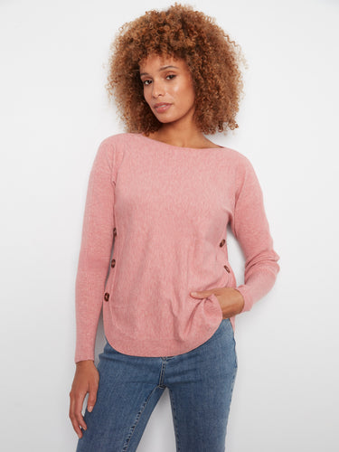 Soft pink sweater with a rounded hem, featuring ribbed sleeves for added texture by Charlie B.