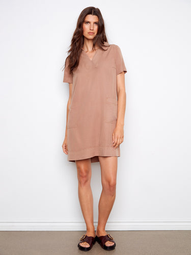 A stylish dress with a flattering collared V-neck, perfect for any occasion. The relaxed fit ensures comfort and elegance by Charlie B.