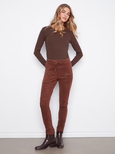 These pants feature a slim fit, perfect for a chic and modern look by Charlie B.