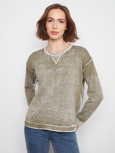 This garment features a crew neckline, offering a classic and comfortable fit for everyday wear. By Charlie B.