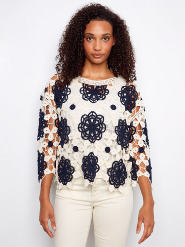 Sophisticated navy top with 3/4 sleeves and a charming crochet design by Charlie B.