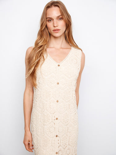 Elegant sleeveless design featuring decorative button details on this knee-length crochet dress by Charlie B.