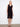 Elegant dress featuring a V-neckline and sleeveless design, perfect for warm weather outings. Crafted with care by Charlie B.