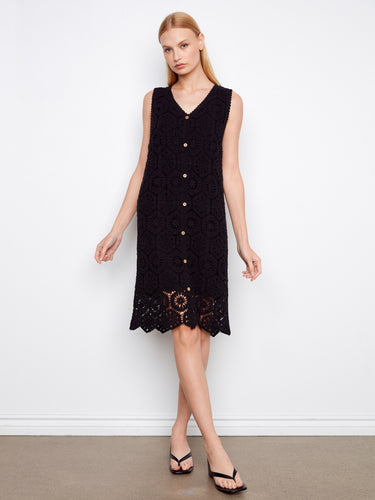 Chic knee-length dress showcasing a beautiful crochet design, adding texture and style to your wardrobe. By Charlie B.