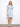 The dress features a classic shirt collar, enhancing its elegant design. Crafted with attention to detail, it offers timeless style by Charlie B.