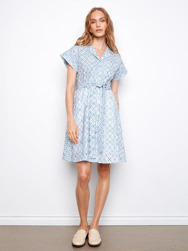 The dress features a classic shirt collar, enhancing its elegant design. Crafted with attention to detail, it offers timeless style by Charlie B.