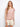 Featuring a stylish boat neckline, this top showcases a chic design in pink-toned stripes, perfect for any casual outing. By Charlie B.