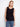 Elegant sleeveless top featuring a crochet design with button-up front, perfect for layering in style by Charlie B.