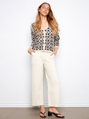 Stylish crochet cardigan featuring a button-front closure for versatile wear, enhancing your casual look by Charlie B.