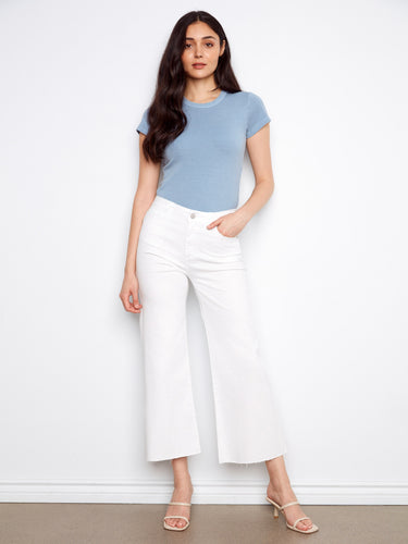 These pants feature a flared leg for a stylish silhouette, perfect for any casual occasion. By Charlie B.
