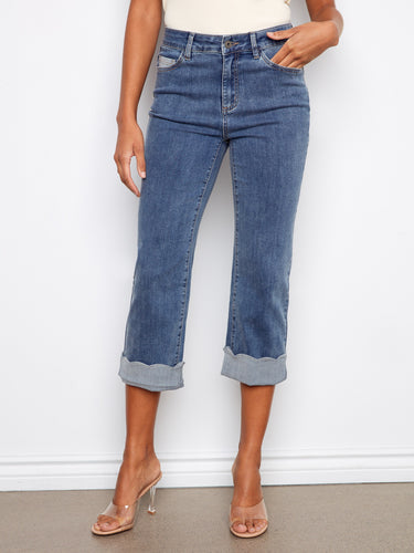Experience the perfect blend of style and comfort with these medium blue cropped jeans featuring five pockets and stretch denim by Charlie B.