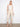 Beige cropped pants featuring a wide leg design with elegant side button details, crafted from stretch twill fabric by Charlie B.