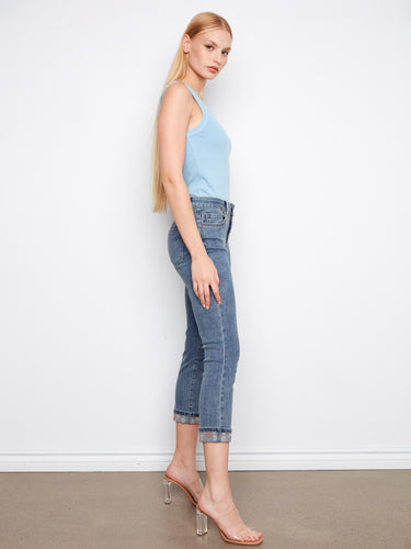 Five-pocket design medium blue jeans with intricate embroidery on the cuffs, offering a chic look by Charlie B.