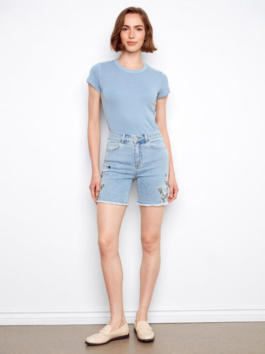 Denim shorts in light blue with intricate side embroidery, crafted from stretch fabric for comfort by Charlie B.