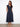 The dress features an empire elastic waist, adding a flattering silhouette for various body types. By Charlie B.