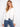 White eyelet denim jacket with frayed hem and button front, showcasing stylish flap pockets by Charlie B.