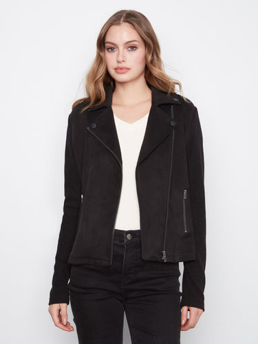 Black faux suede moto jacket with rib knit sleeves and notched lapel collar, featuring zip closure and zipper pockets by Charlie B.