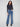 Medium blue jeans with a flare leg and floral embroidery, crafted in stretch denim for comfort by Charlie B.