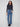 These five-pocket design jeans in medium blue offer both style and functionality with floral accents by Charlie B.