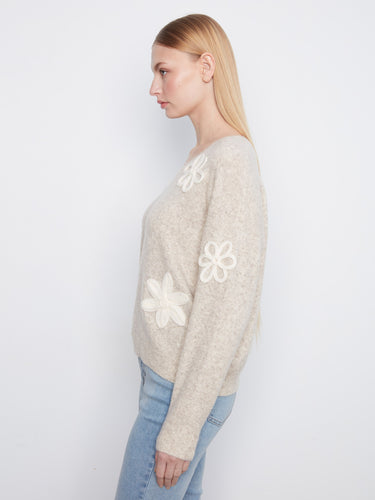 V-neck design in heather-almond with exquisite floral appliquรฉ detailing enhances this cozy sweater by Charlie B.