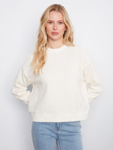 Buttercream sweatshirt featuring a relaxed fit and elegant floral soutache design, perfect for casual wear by Charlie B.