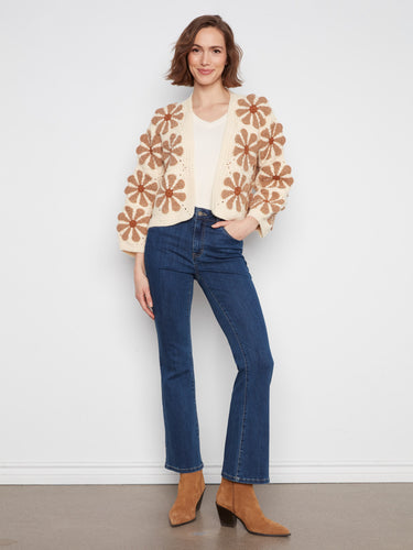 Cropped ecru crochet cardigan adorned with handcrafted floral patterns and open-front style by Charlie B.