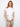 White top featuring floral embroidery and cap sleeves, crafted from 100% cotton for comfort by Charlie B.