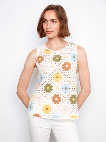 A delightful floral pattern graces this sleeveless top, making it an ideal choice for sunny days by Charlie B.