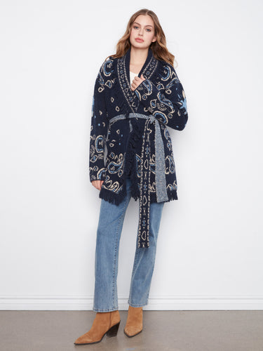 Navy blue cardigan with a shawl collar and geometric jacquard pattern, featuring patch pockets and a self-tie belt by Charlie B.