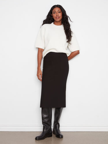 This stylish skirt features a straight fit, offering a sleek silhouette for any occasion. By Charlie B.