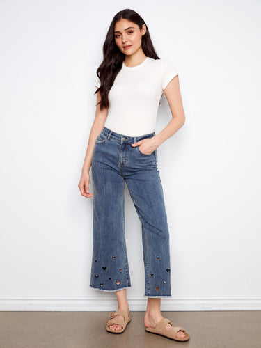 Medium blue jeans with a chic wide leg and heart cutouts, crafted from stretch denim for comfort by Charlie B.